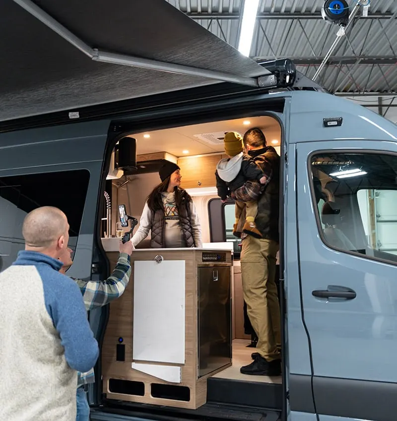 A van on the production floor of the Elk Grove Village shop, panels off and cabinetry going in