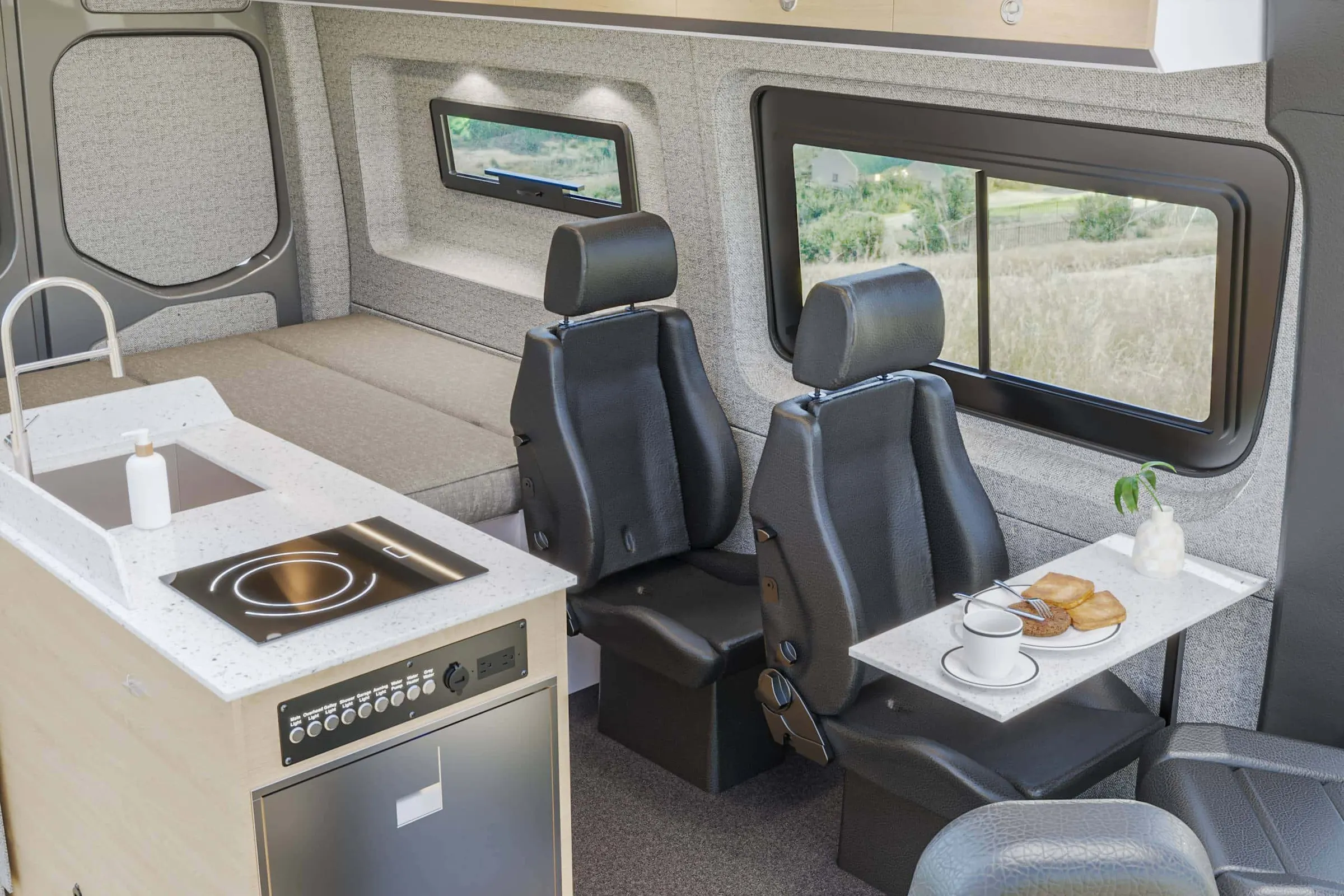 Kinabalu interior in the Estes color package, the galley and the dinette seen from the side door, with the table set