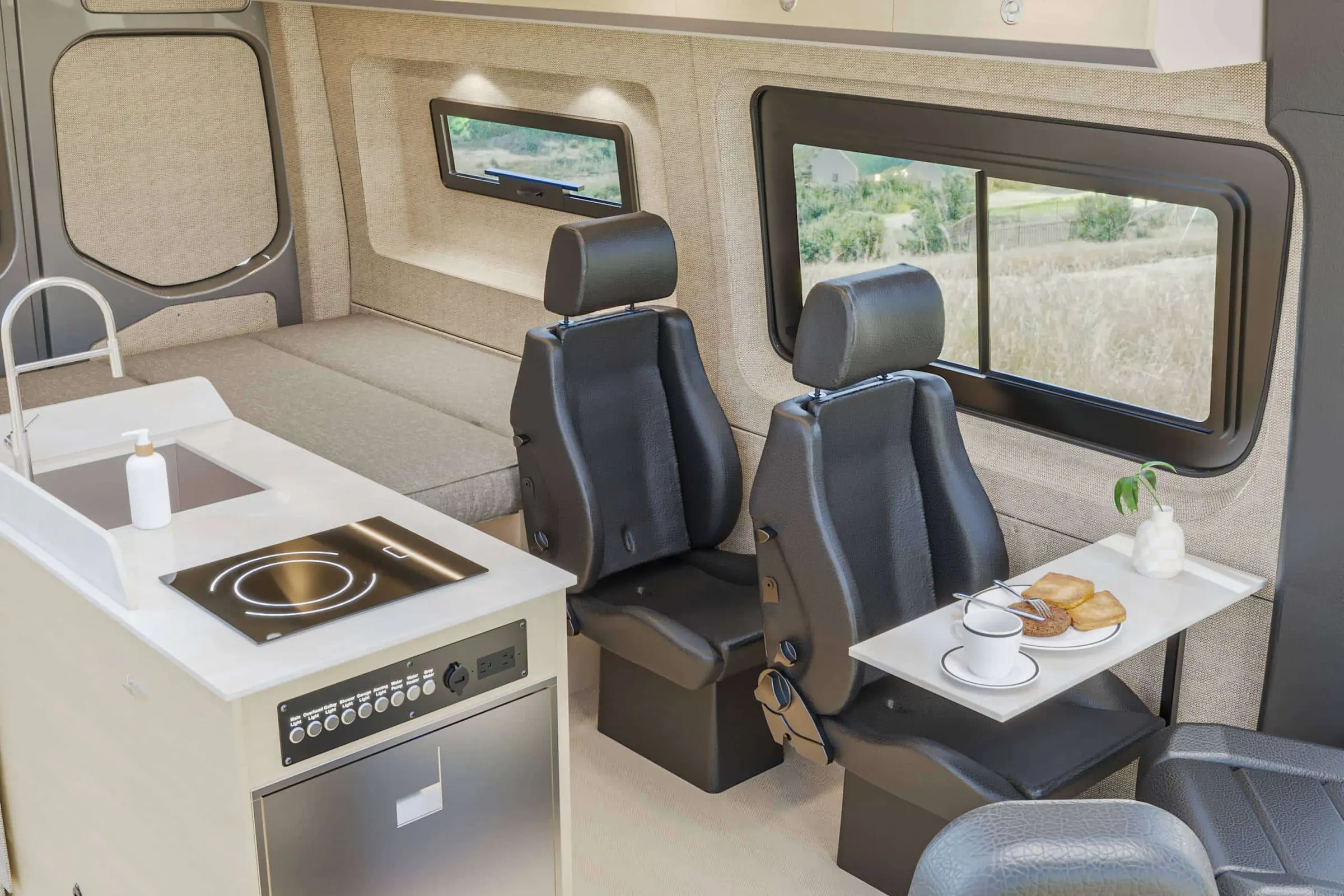 Kinabalu interior in the Stowe color package, the galley and the dinette seen from the side door, with the table set