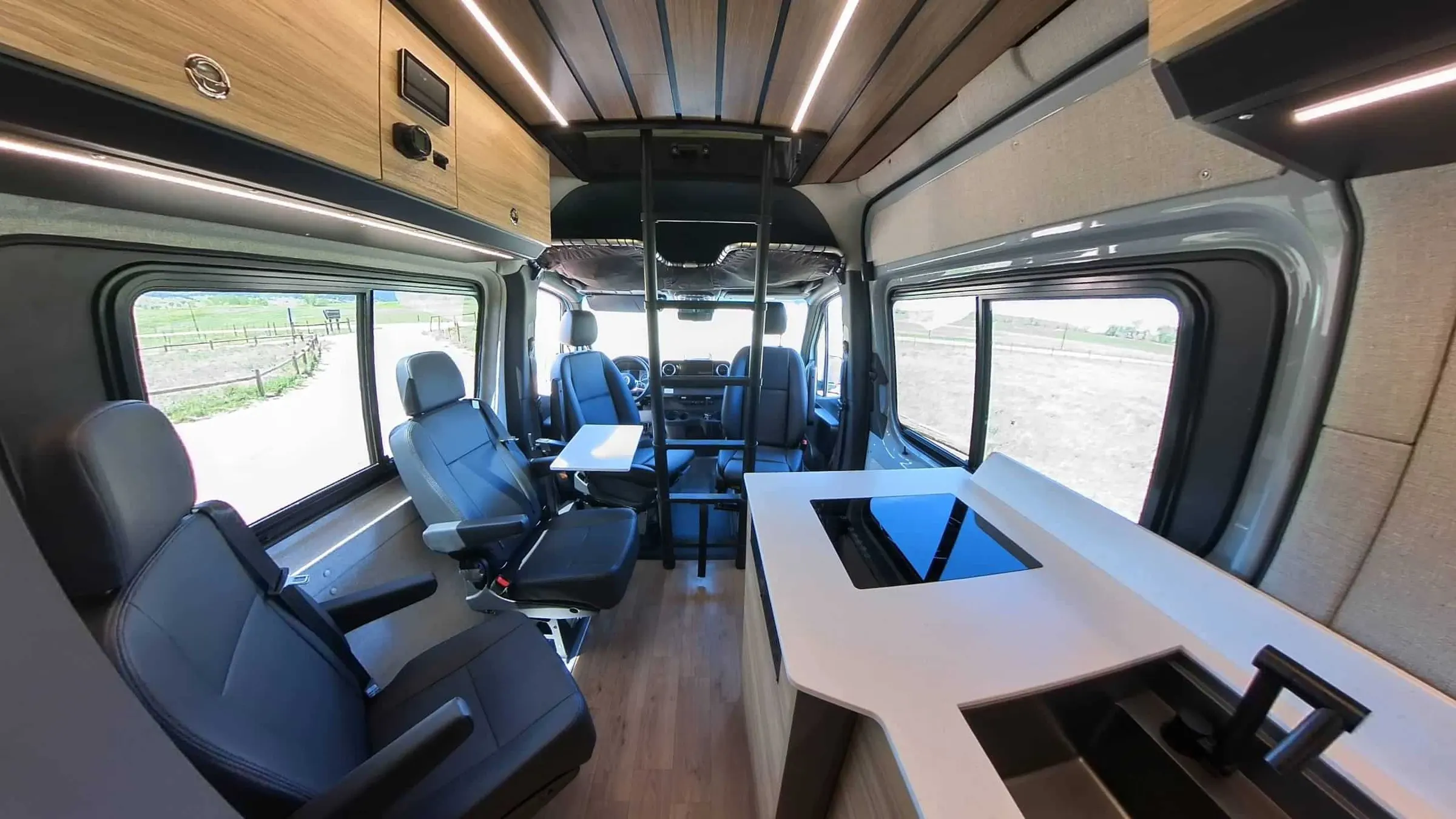 Parbat cabin looking forward, with the dinette on the left and the galley counter on the right
