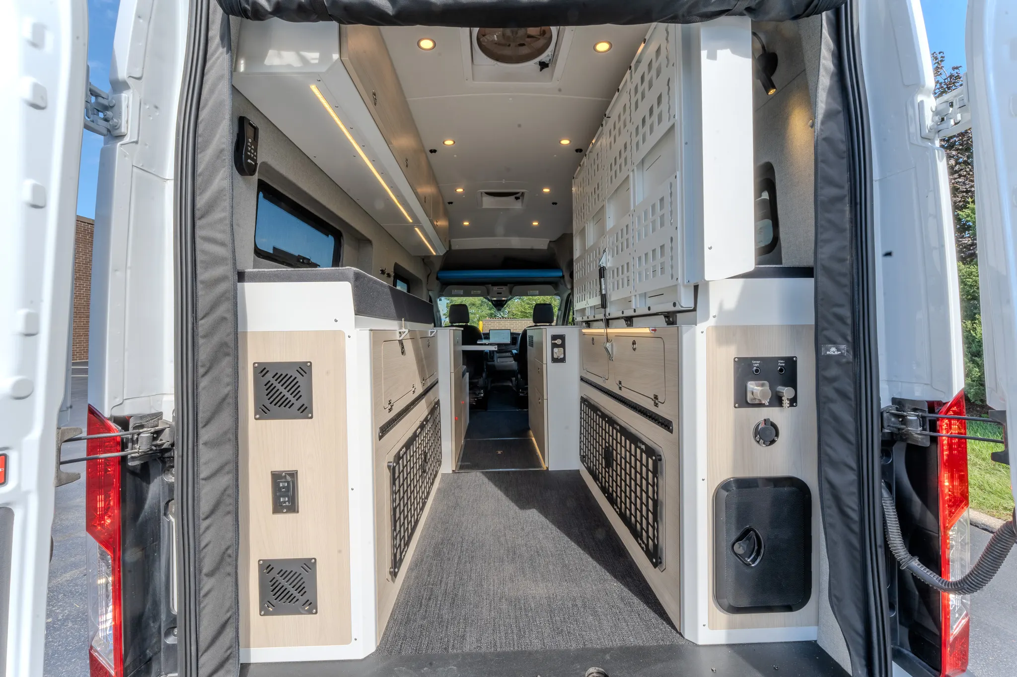 The full length of the interior, seen through the rear doors