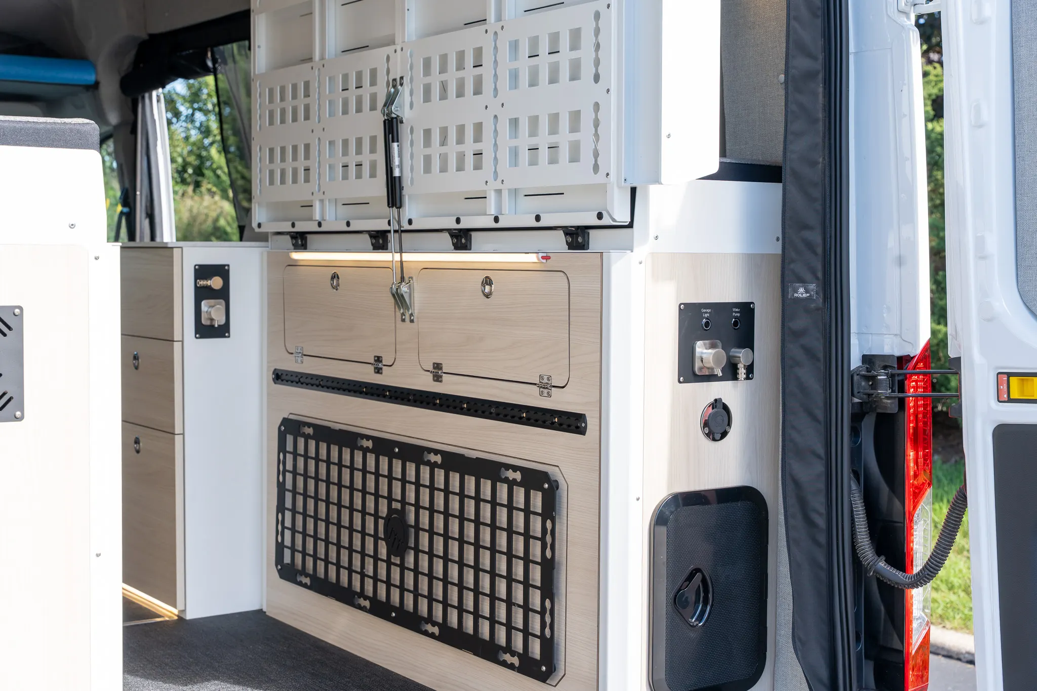 The utility cabinet in the garage on the passenger side