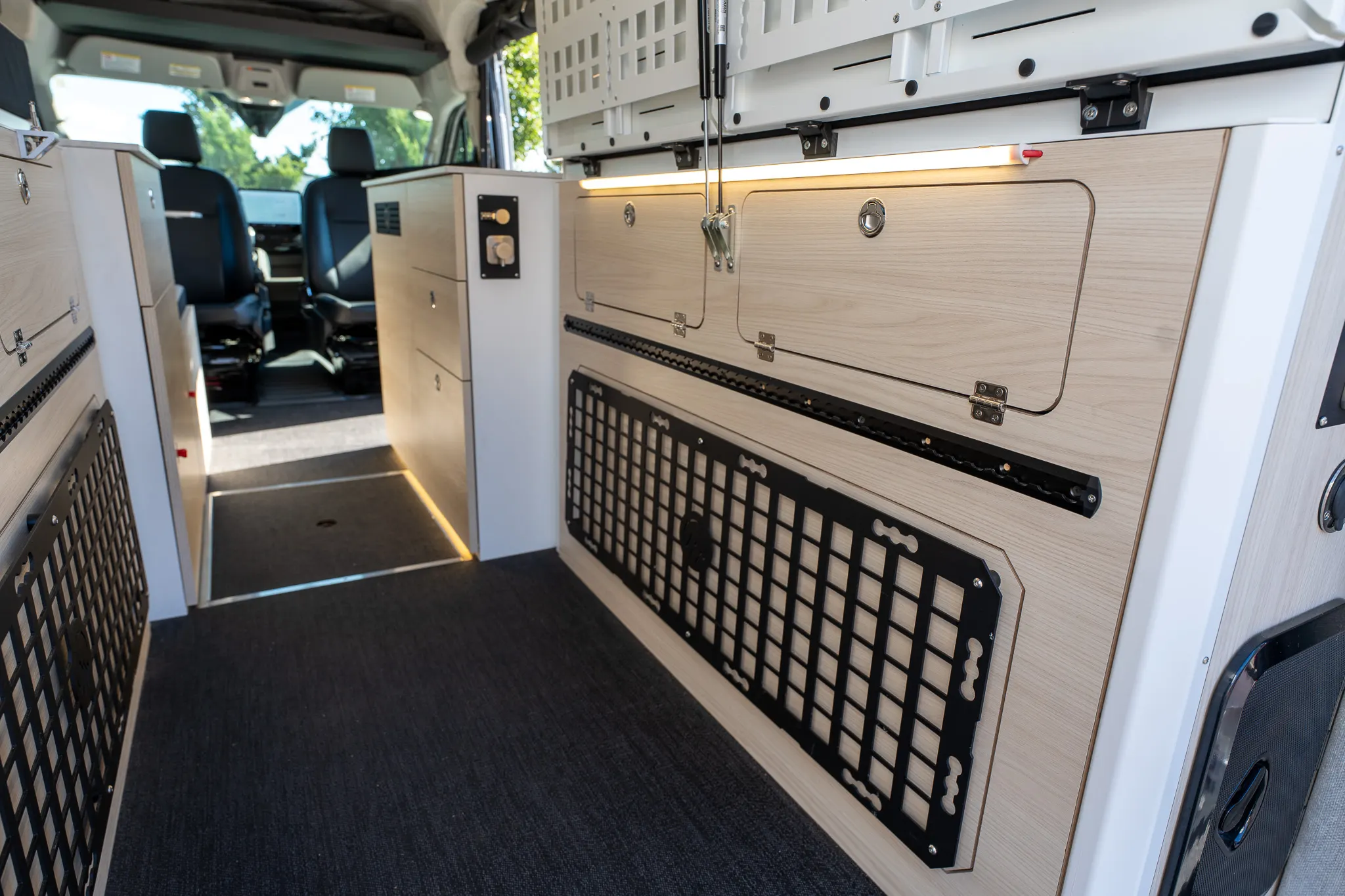 The cabinets on both sides of the aisle, looking forward