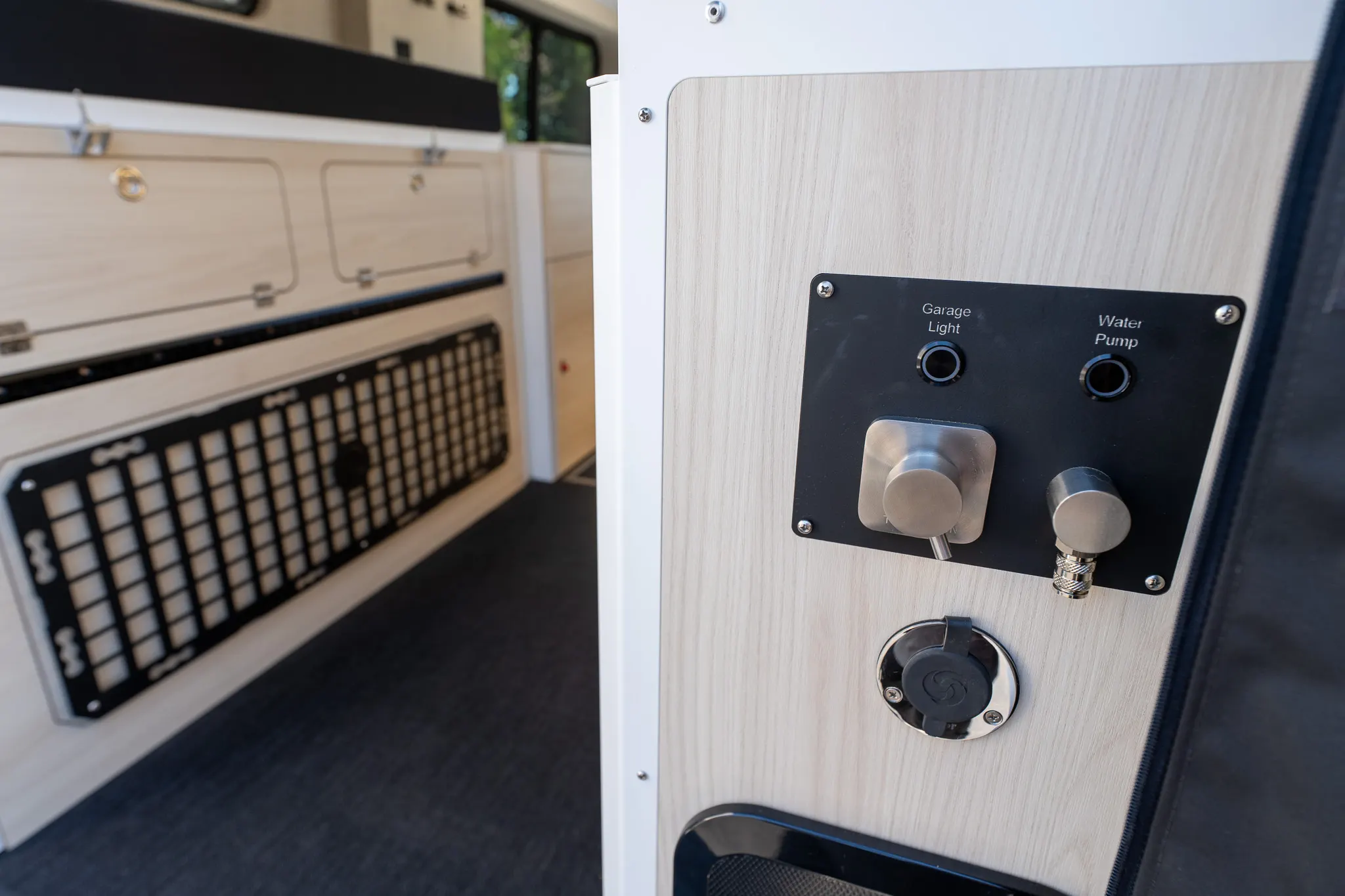 The garage light and water pump switches inside the rear doors