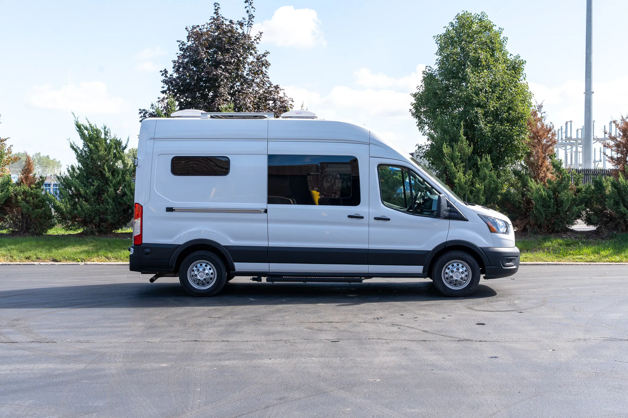 The passenger side in profile, showing the slider and bunk windows