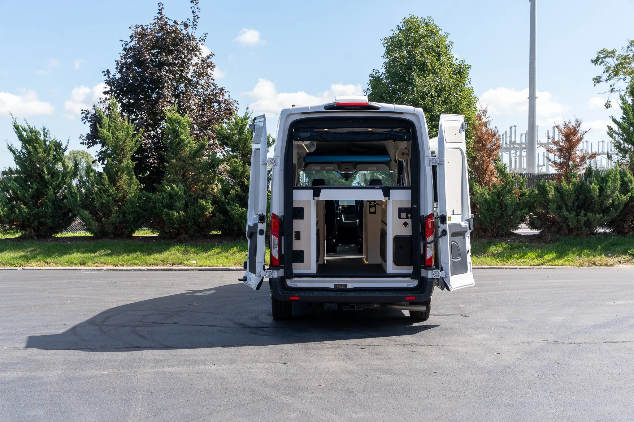 The rear doors open on the garage and the aisle