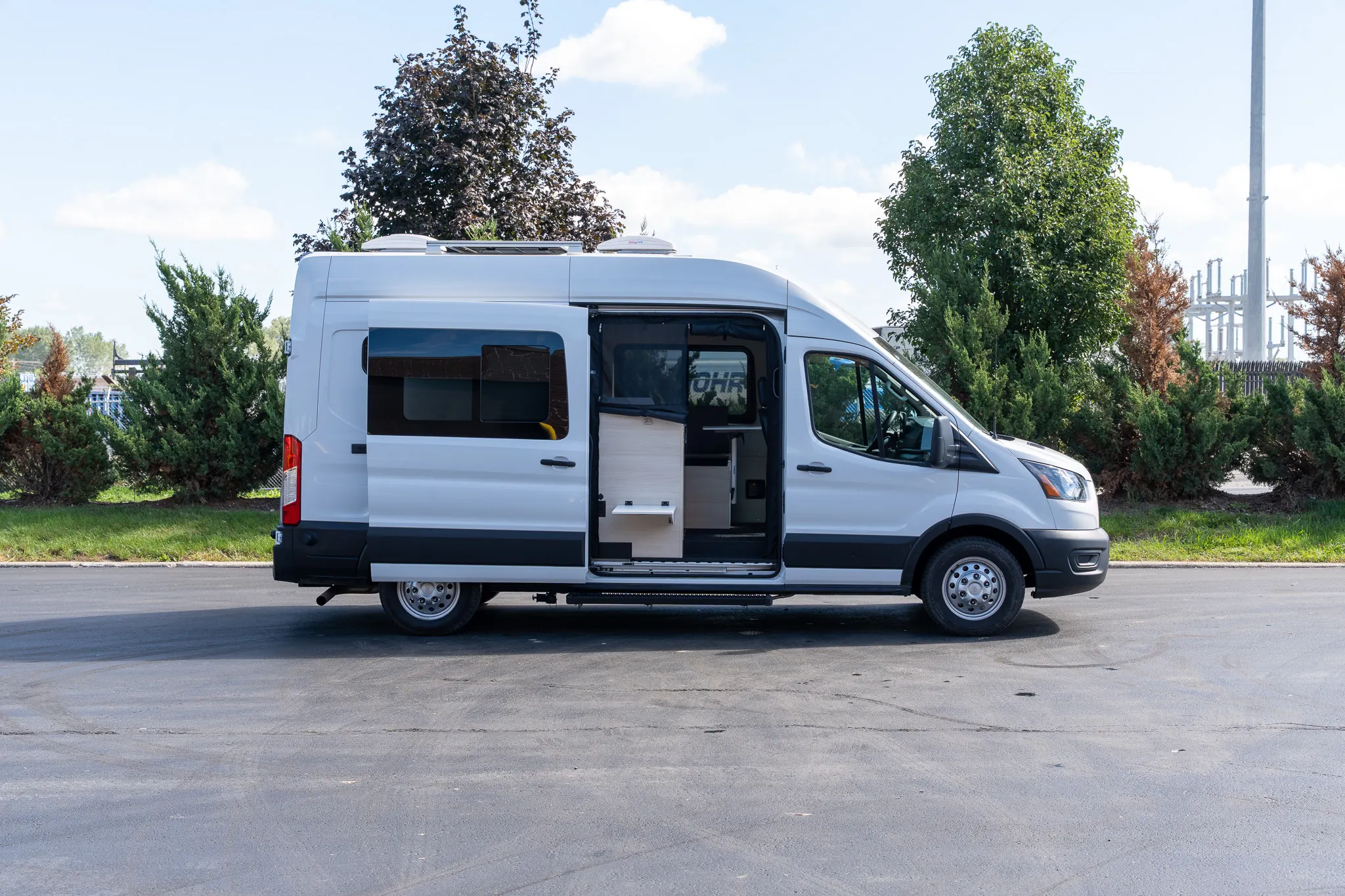 The passenger side with the sliding door open on the kitchen and bench