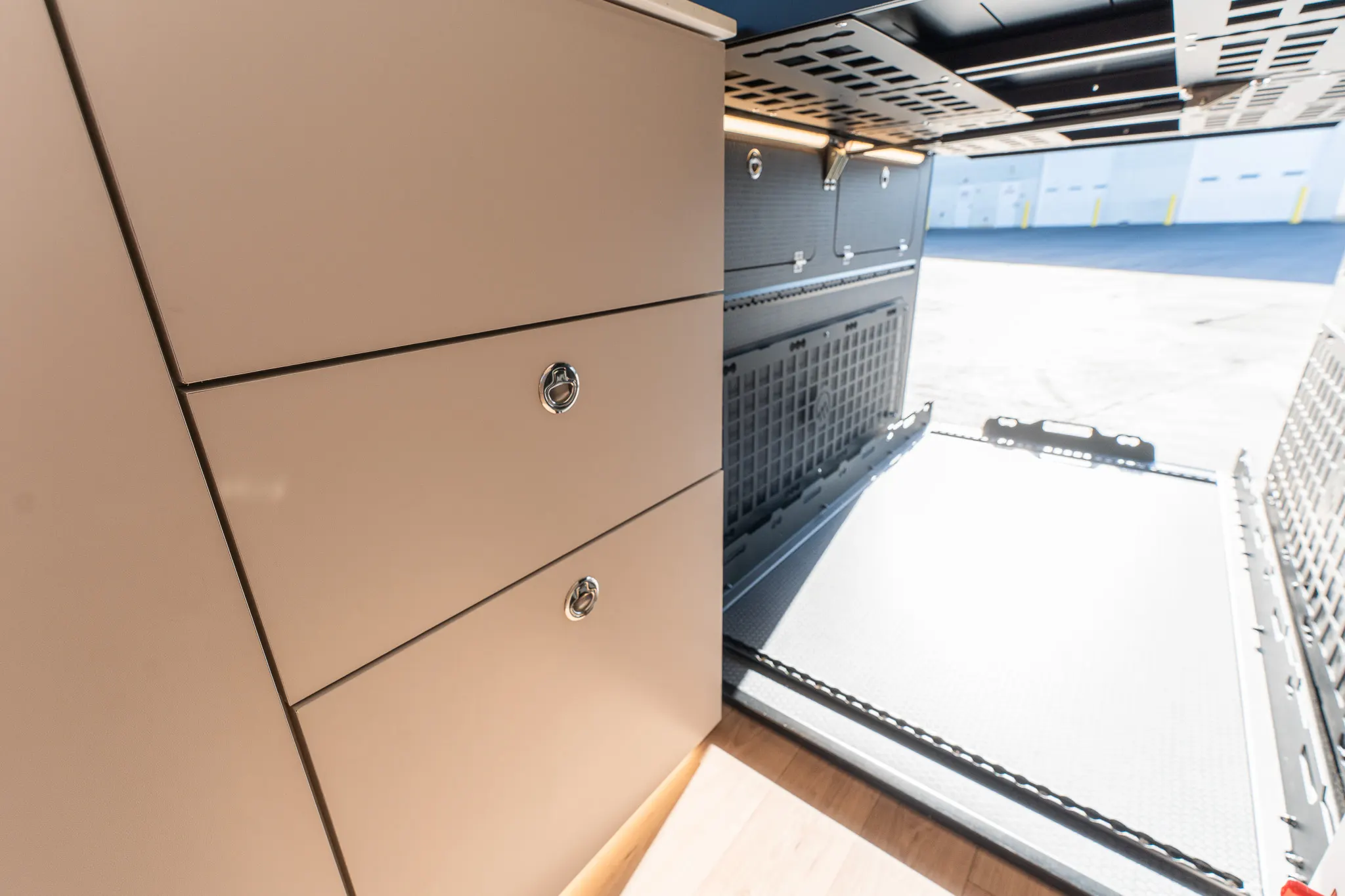 The garage drawers under the bed, with the rear doors open