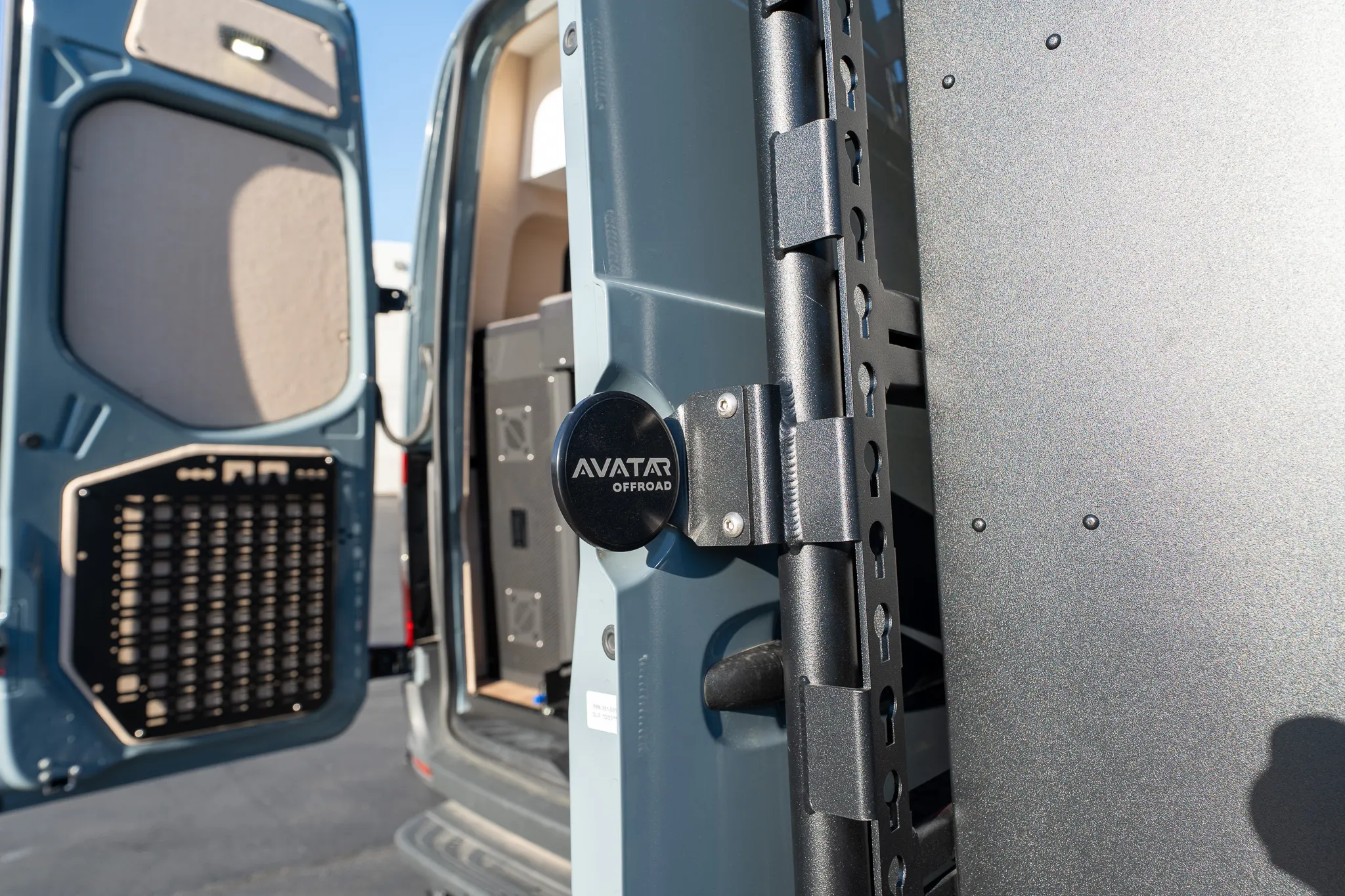 The MOLLE panel and the latch on the inside of a rear door