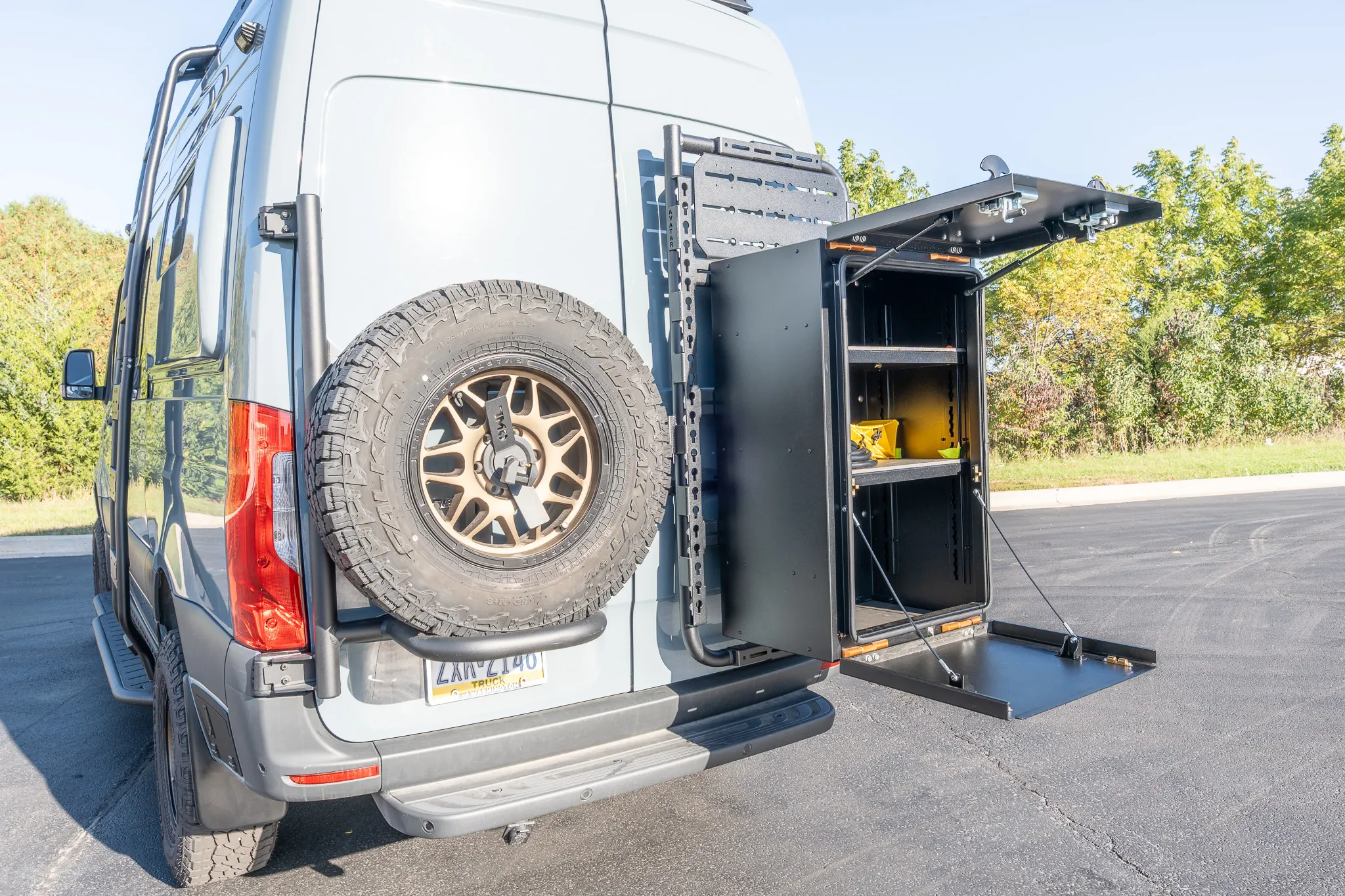 The Avatar storage box swung open behind the rear door, with its shelf