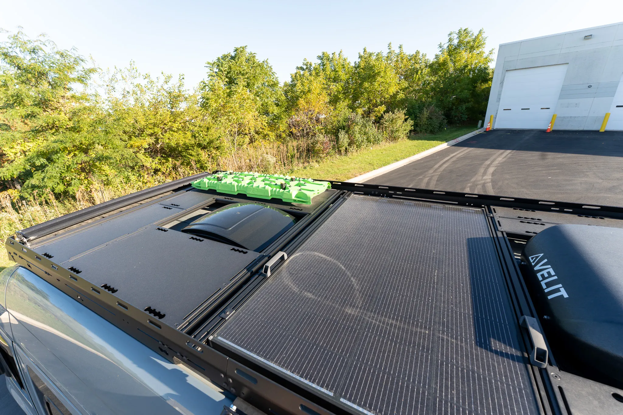 The roof, with the solar panel, the decking, the air conditioner and the recovery boards