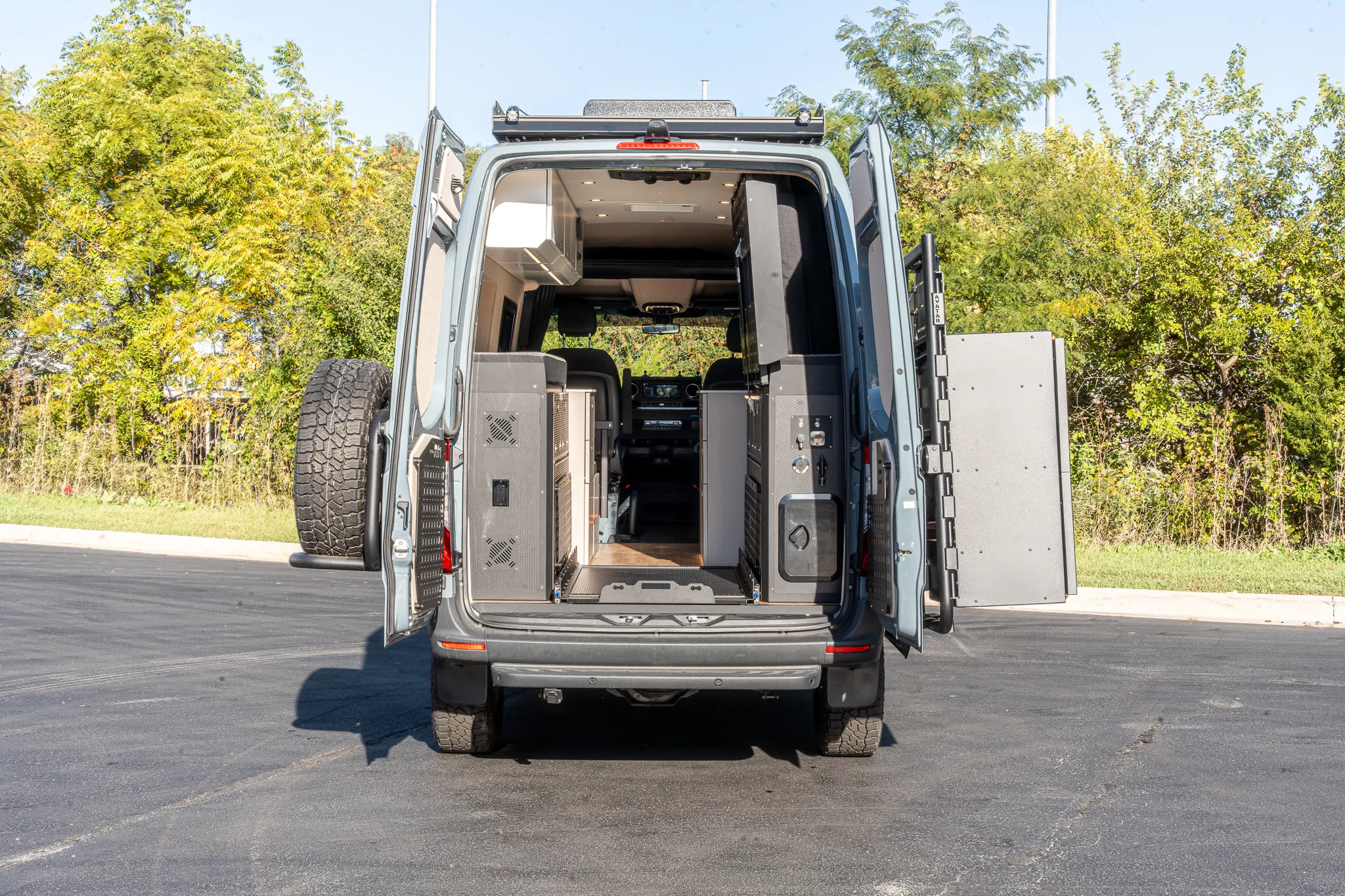 The rear doors open on the full length of the interior to the cab